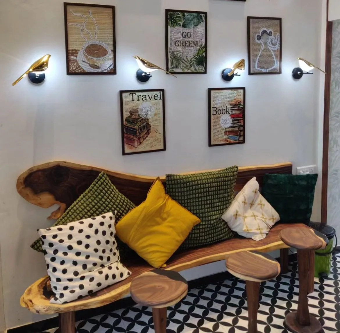 Cushioned seating with timber side tables at The Good Stuff Café
